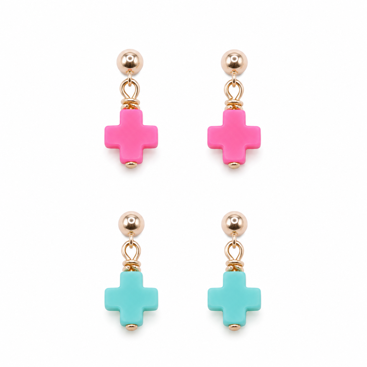 Pair of earrings with pink and turquoise cross-shaped beads on a white background