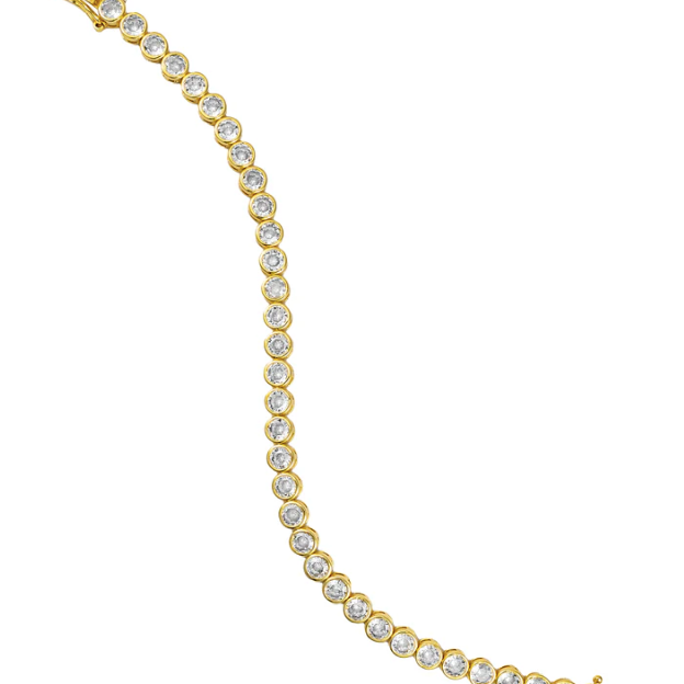Gold bracelet with clear stones on a white background