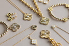 Gold jewelry set with clover designs