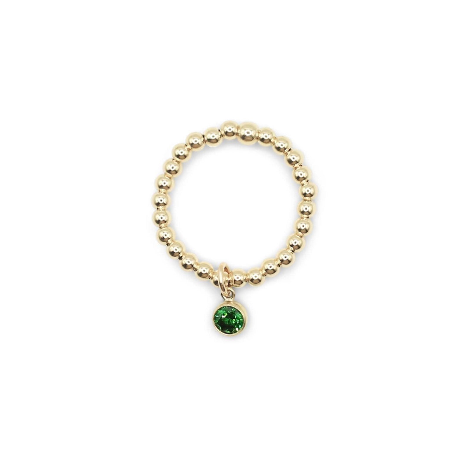 A gold-filled charm ring with a green-colored charm