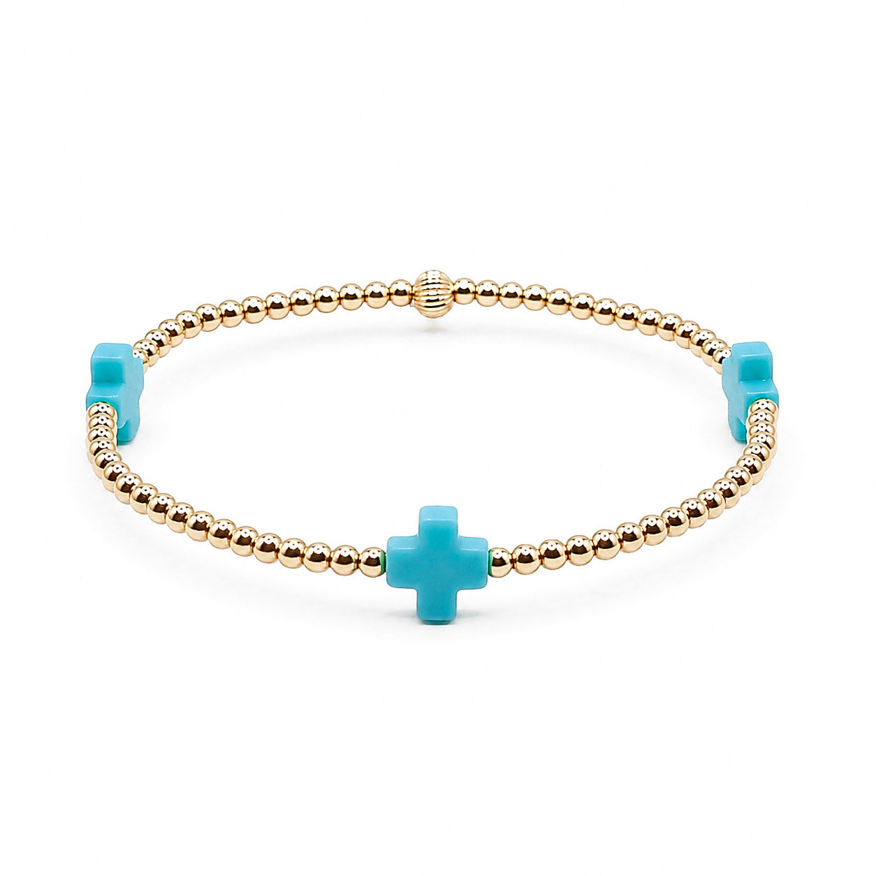 Bracelet with gold beads and turquoise cross charms on a white background