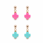 Pair of earrings with pink and turquoise cross-shaped beads on a white background