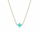 Necklace with a mint cross pendant on a non tarnishing gold chain.