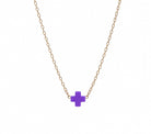 Necklace with a purple cross pendant on a non tarnishing gold chain.