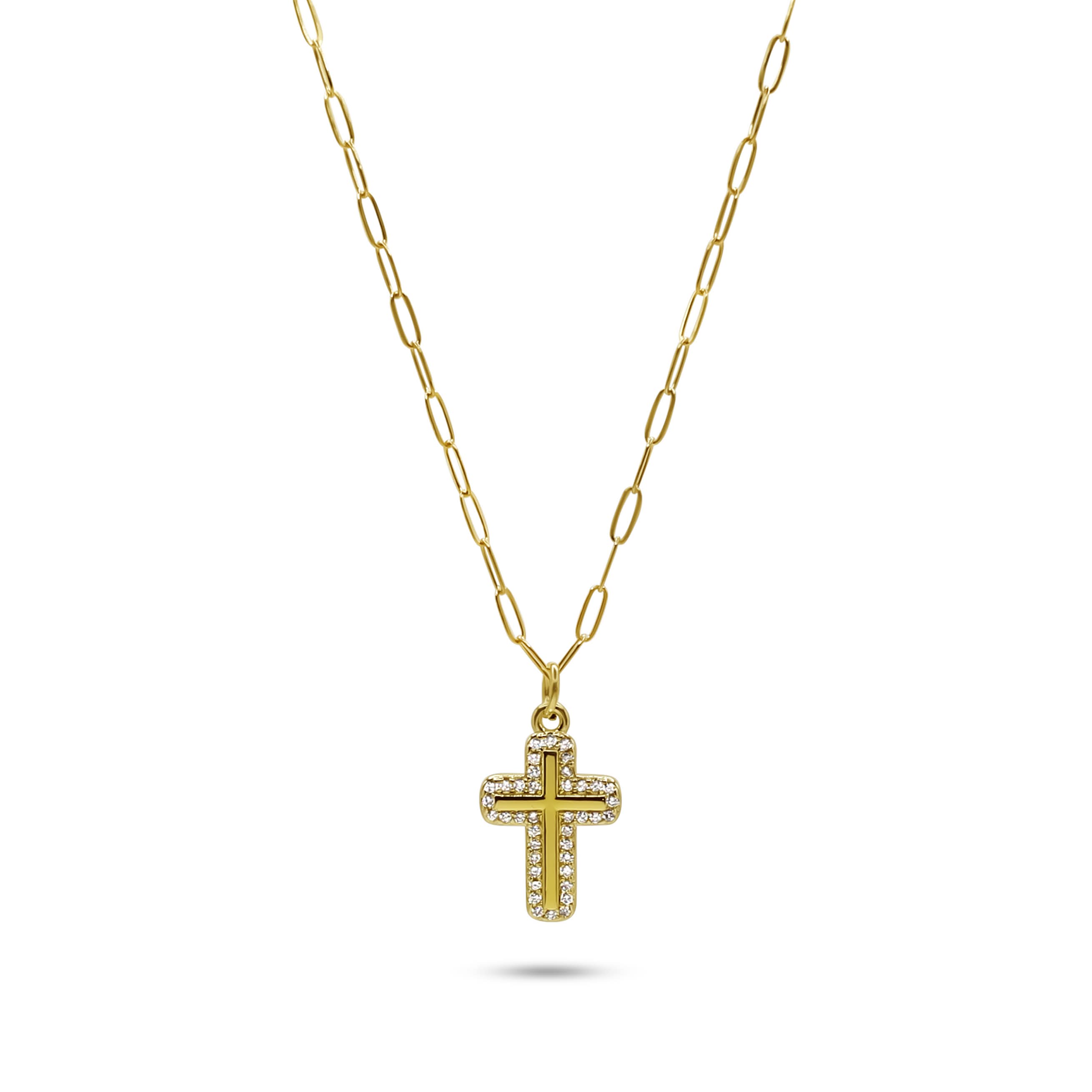 Gold cross necklace on a white background